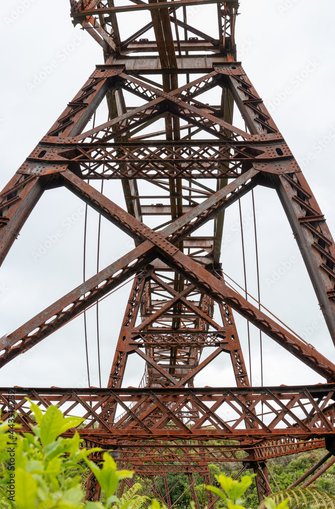 Old unused iron train bridge at the Old Coach Road, New Zealand