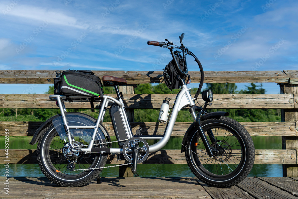 Fototapeta premium Moped Style Electric Bike with river in background