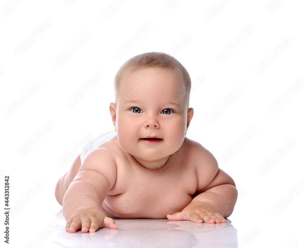 Infant child baby girl kid in diaper lying happy looking at the camera isolated on a white background Infant child baby girl kid in diaper lying happy looking at the camera isolated on a white background