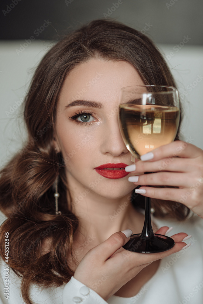 Close portrait of a bride with a glass of champagne Close portrait of a bride with a glass of champagne