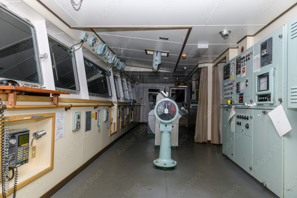 Navigational bridge on big cargo ship. Wheelhouse on vessel. Navigational bridge on big cargo ship. Wheelhouse on vessel.