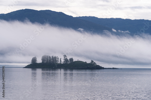 Island in sea with fog © David Katz