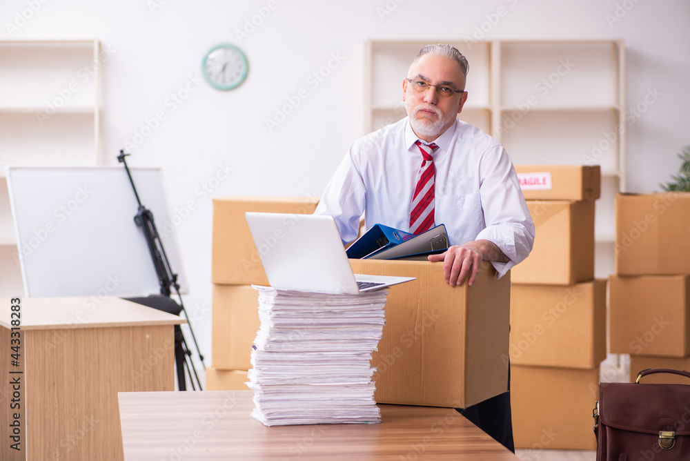 Old businessman employee in relocation concept Old businessman employee in relocation concept