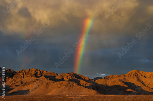 A stunning rainbow over the horizon in the desert of Nevada. 