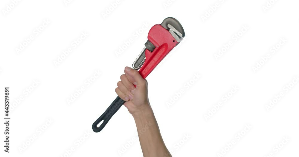 Hand of plumber with pipe wrench on white background Hand of plumber with pipe wrench on white background