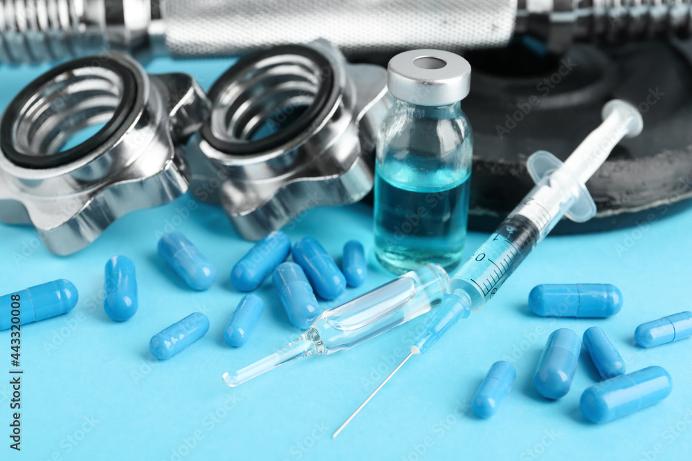 Different drugs and sports equipment on light blue background. Doping control Different drugs and sports equipment on light blue background. Doping control