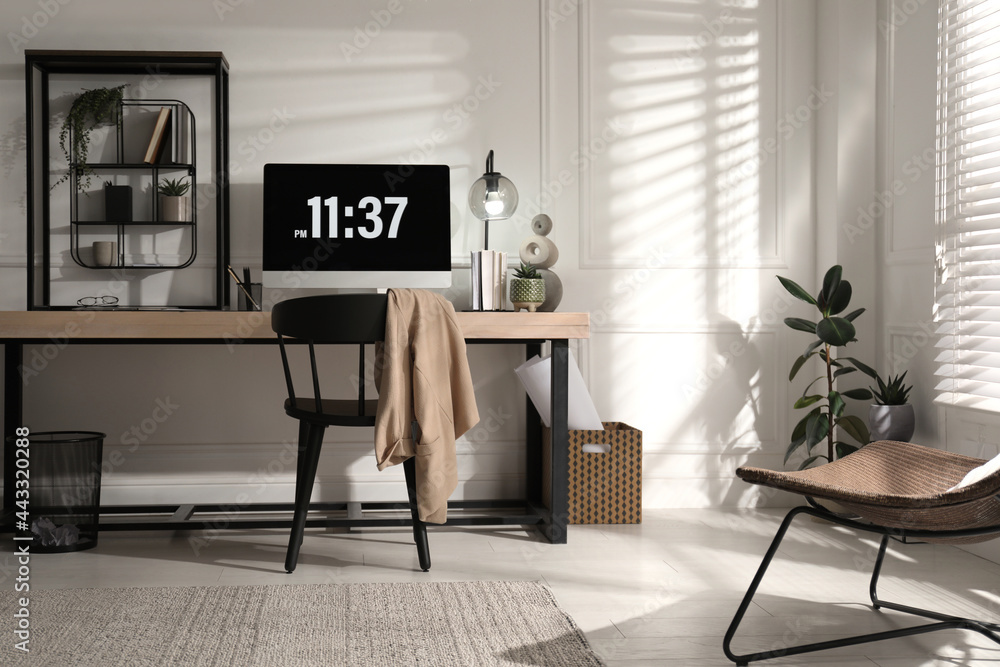 Room interior with comfortable workplace. Modern computer on wooden desk Room interior with comfortable workplace. Modern computer on wooden desk