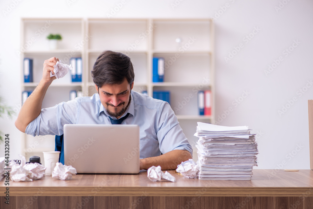 Young male employee rejecting new ideas in the office Young male employee rejecting new ideas in the office