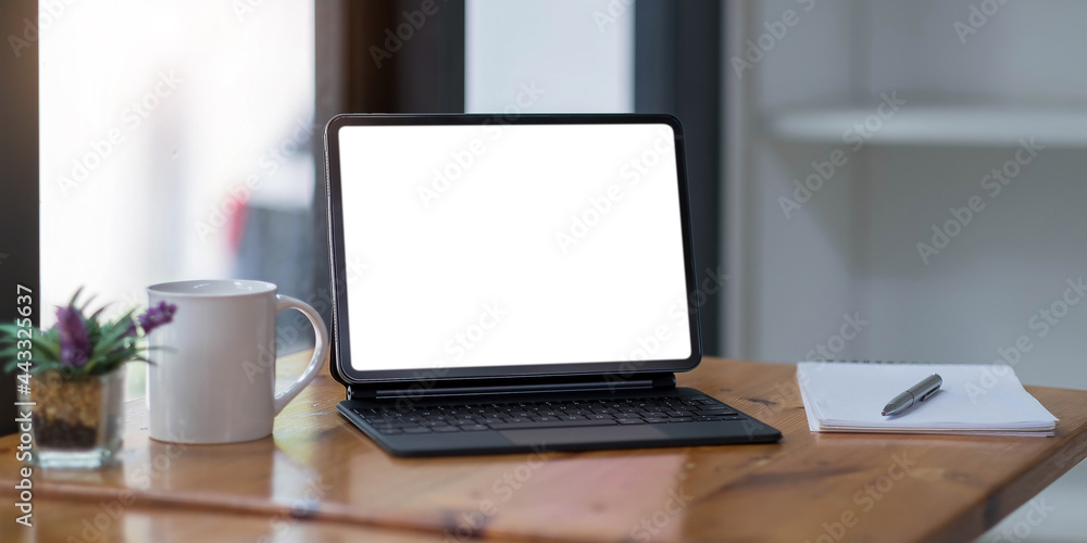 Blank screen Laptop computer and poster workspace background in modern office Blank screen Laptop computer and poster workspace background in modern office