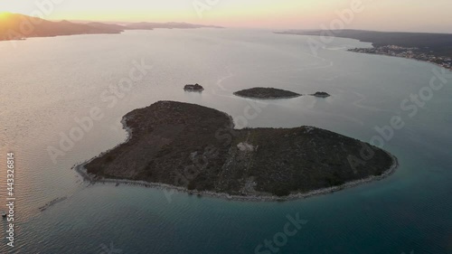 Galesnjak Island, Zadar archipelago, Dalmatia region of Croatia. Heart shaped islet sunset view photo