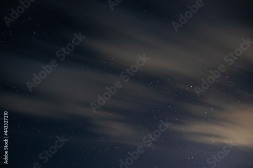 Sky at night with mountains and stars