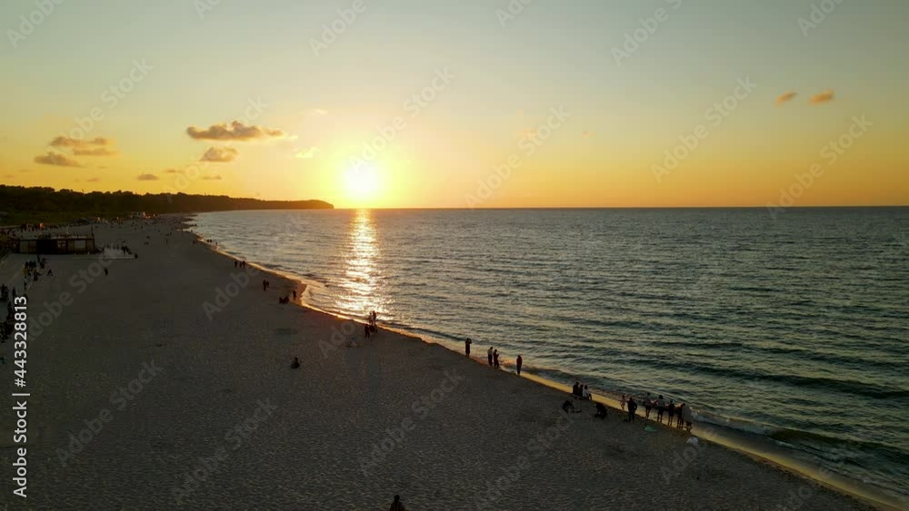 Aerial View Of People Watching Beautiful Sunset At The Beach In Wladyslawowo, Poland. Aerial View Of People Watching Beautiful Sunset At The Beach In Wladyslawowo, Poland.