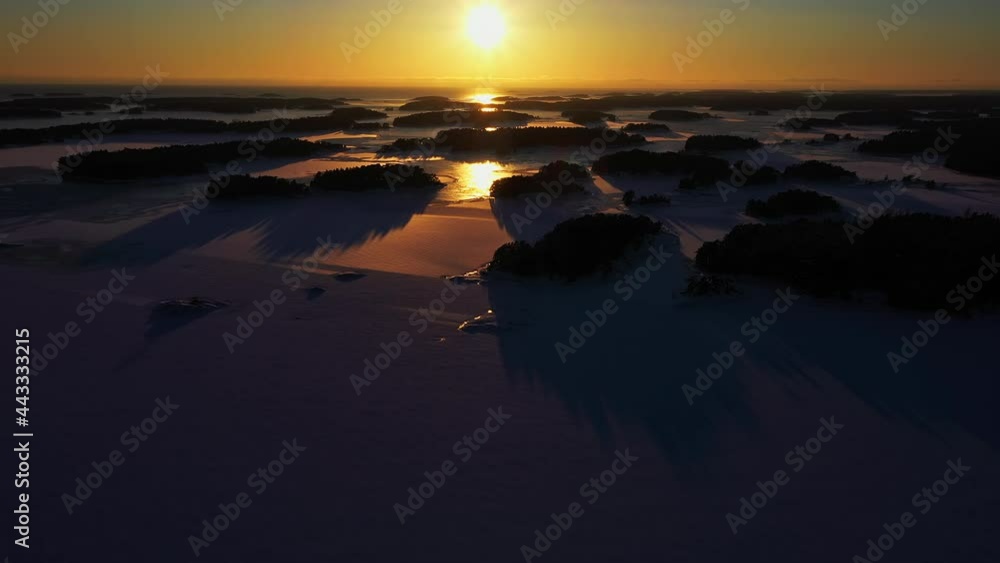 Sunset Over Far Reaching Winter Landscape of Archipelago Islands, Aerial Established Shot Sunset Over Far Reaching Winter Landscape of Archipelago Islands, Aerial Established Shot