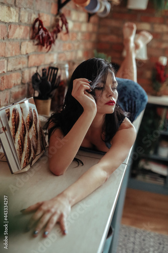 Girl on a kitchen table © racool_studio