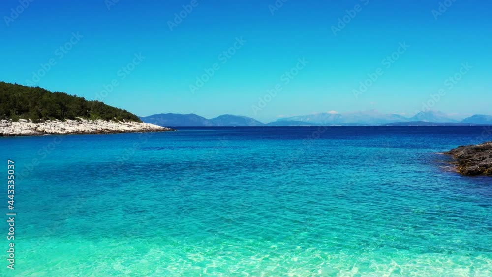 Drone flying low and fast over the beach, and over the sea in Kimilia, Greece. It is a beautiful sunny summer day. Drone aerial 4K stock footage Drone flying low and fast over the beach, and over the sea in Kimilia, Greece. It is a beautiful sunny summer day. Drone aerial 4K stock footage