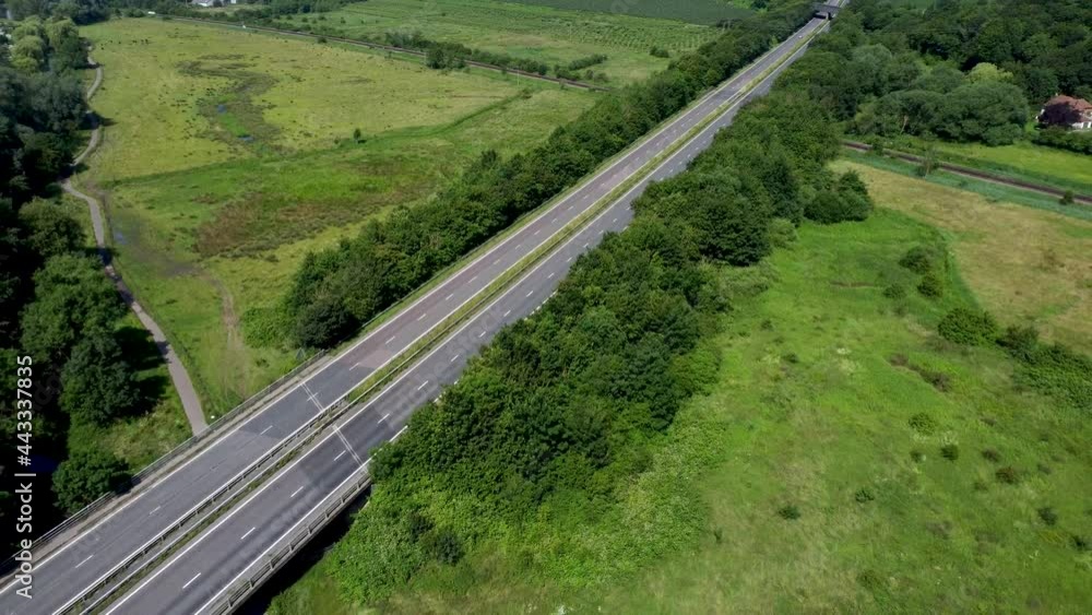 Drone moving over the A2 dual carriage way that crosses the River Stour in Canterbury.