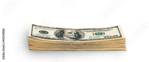 A stack of packaged dollars on a white background. One hundred American dollar bills. The pile of dollars is isolated with a shadow. A big wad of dollars.
