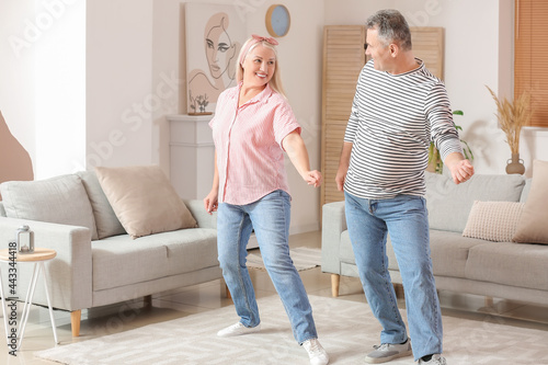 Happy senior couple dancing...