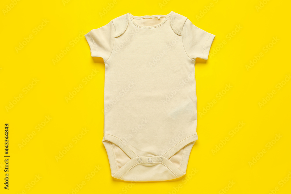 Baby clothes on color background Baby clothes on color background