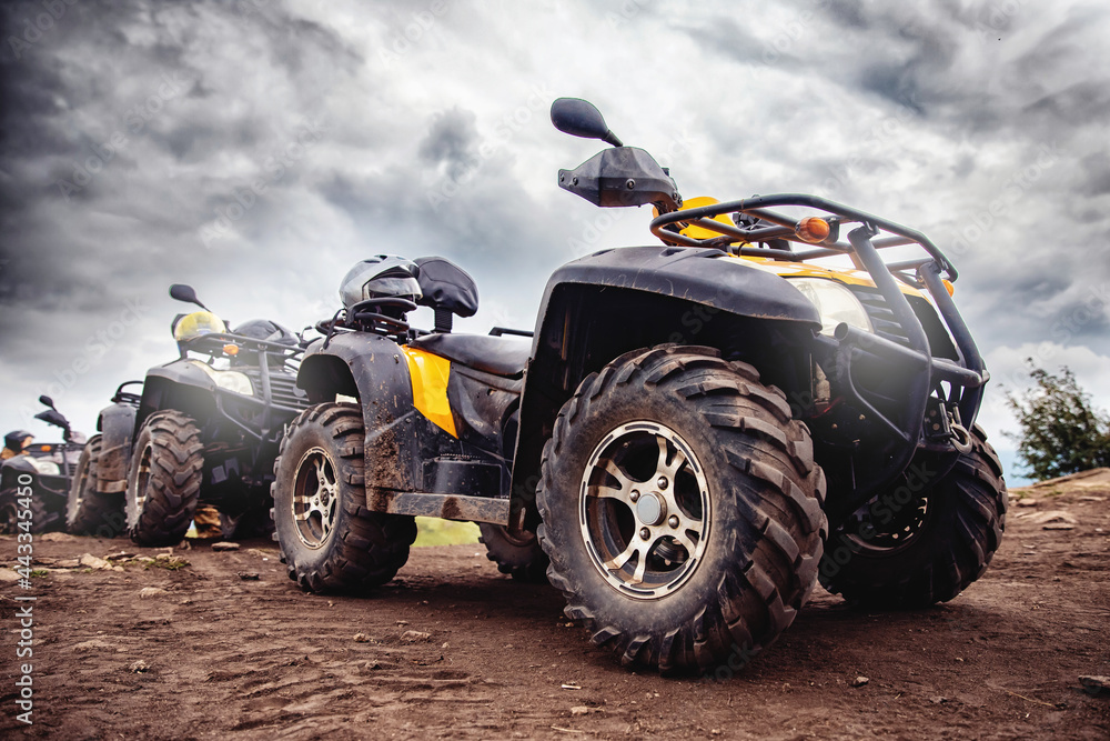 ATV quad bike on forest offroad, front view. Concept motocross quadricycle summer travel ATV quad bike on forest offroad, front view. Concept motocross quadricycle summer travel