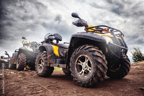 ATV quad bike on forest offroad, front view. Concept motocross quadricycle summer travel photo