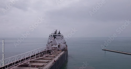 Deck Of MV Sam Laud Bulk Carrier Dock In The Harbour With Seascape Covered In Fog. - aerial photo