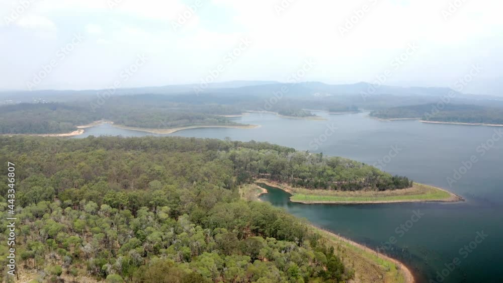 Aerial View Of Green Forest At The Waterfront Of A Calm Lake In Sunshine Coast Region In QLD, Australia. Aerial View Of Green Forest At The Waterfront Of A Calm Lake In Sunshine Coast Region In QLD, Australia.