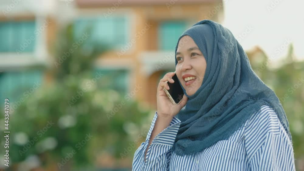 good looking Muslim women working off-site according to the slogan Work form home. She sits at work and talks on her cell phone. stay in private accommodation, 4k resolution. good looking Muslim women working off-site according to the slogan Work form home. She sits at work and talks on her cell phone. stay in private accommodation, 4k resolution.
