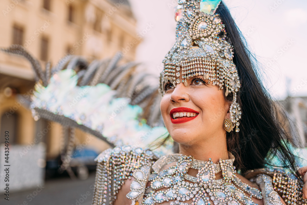 Beautiful Brazilian woman wearing colorful Carnival costume and smiling ...