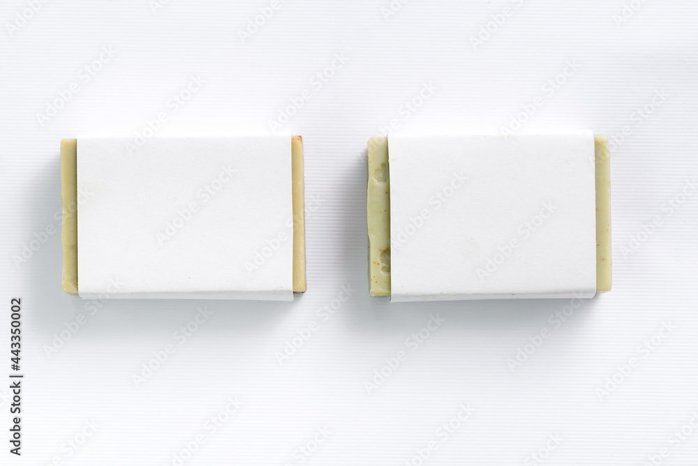 Hand made olive soap bars on white background, top view. Mockup for design - obrazy, fototapety, plakaty 