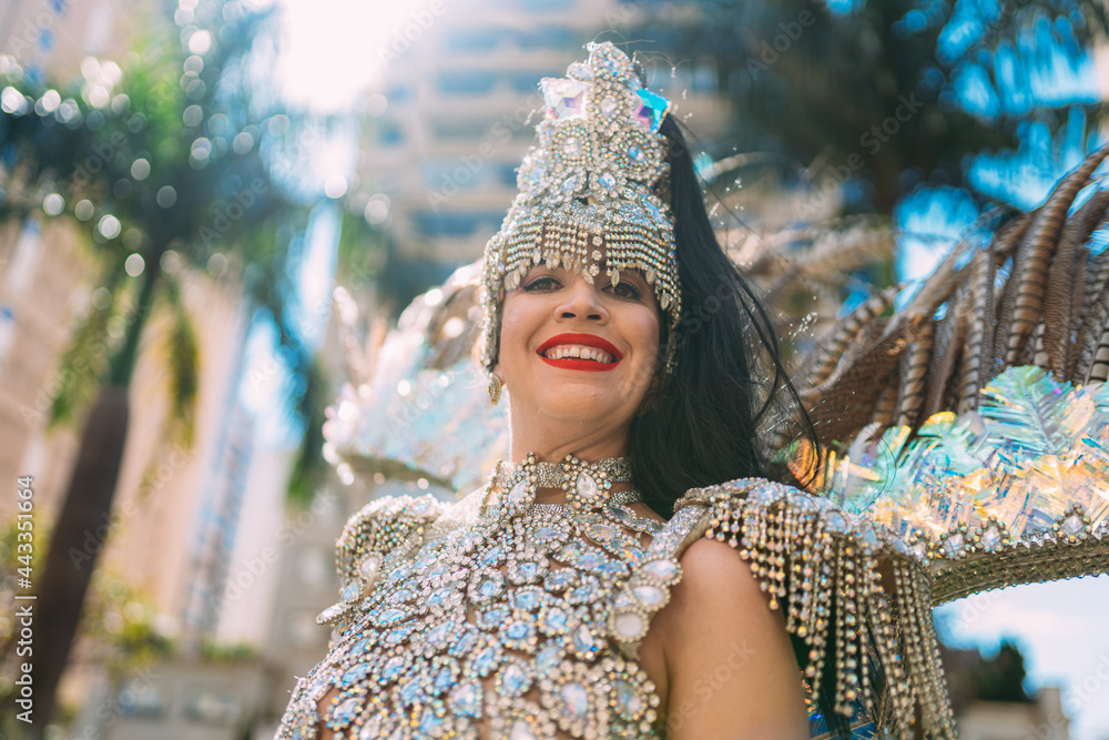 Beautiful Brazilian woman wearing colorful Carnival costume and smiling ...