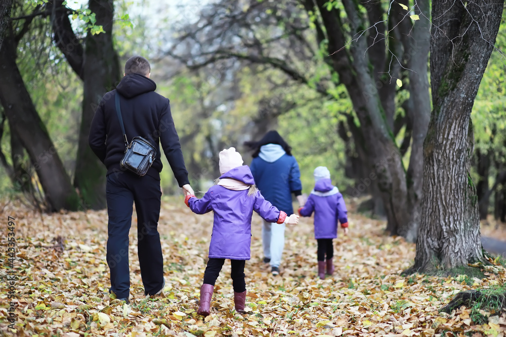 Leaf fall in the park. Children for a walk in the autumn park. Family. Fall. Happiness. Leaf fall in the park. Children for a walk in the autumn park. Family. Fall. Happiness.