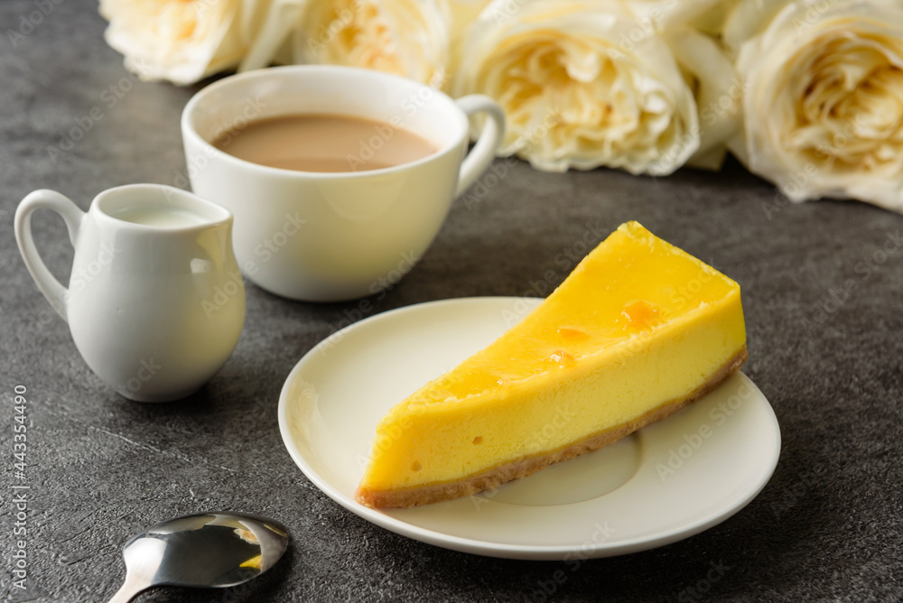 Fototapeta premium lemon cheesecake with coffee close-up.