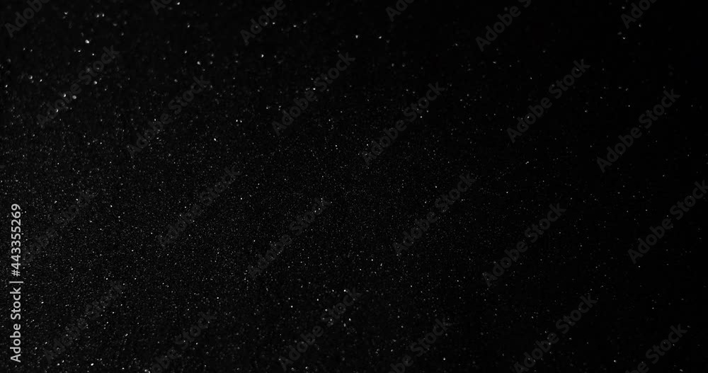 Silver glitter black sand or diamond dust creating abstract shimmering glow formations blinking metamorphosis. Art background texture glamour Silver glitter black sand or diamond dust creating abstract shimmering glow formations blinking metamorphosis. Art background texture glamour