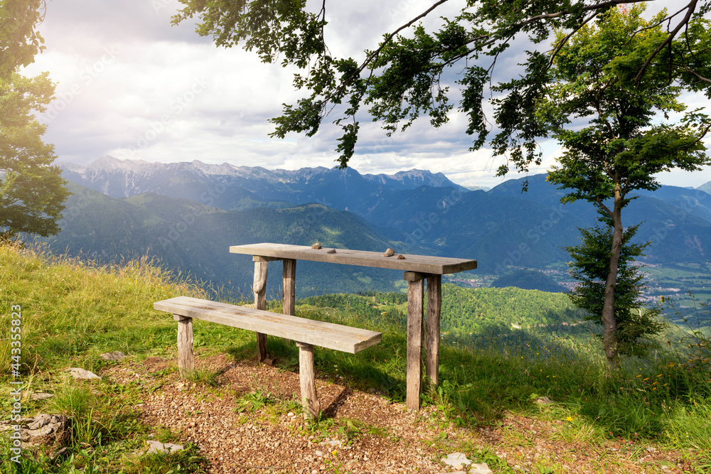 Wooden rest place with view on Alps