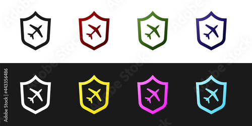 Set Plane with shield icon isolated on black and white background. Flying airplane. Airliner insurance. Security, safety, protection, protect concept. Vector.