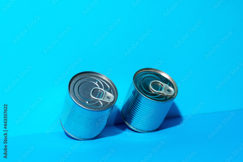Tin can with food on blue background Tin can with food on blue background