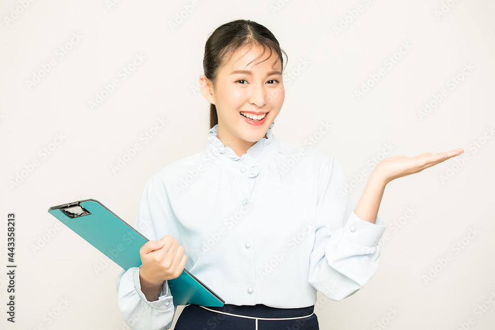 Portrait of pretty female office worker, business woman person showing something with business file material in isolate empty background Portrait of pretty female office worker, business woman person showing something with business file material in isolate empty background