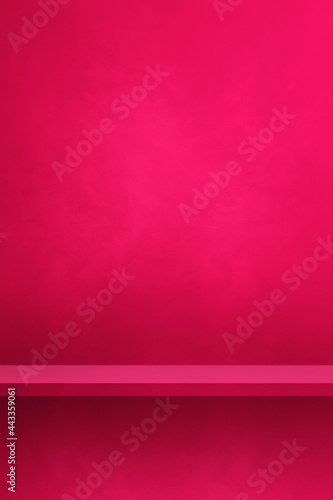 Empty shelf on a pink wall. Background template. Vertical backdrop