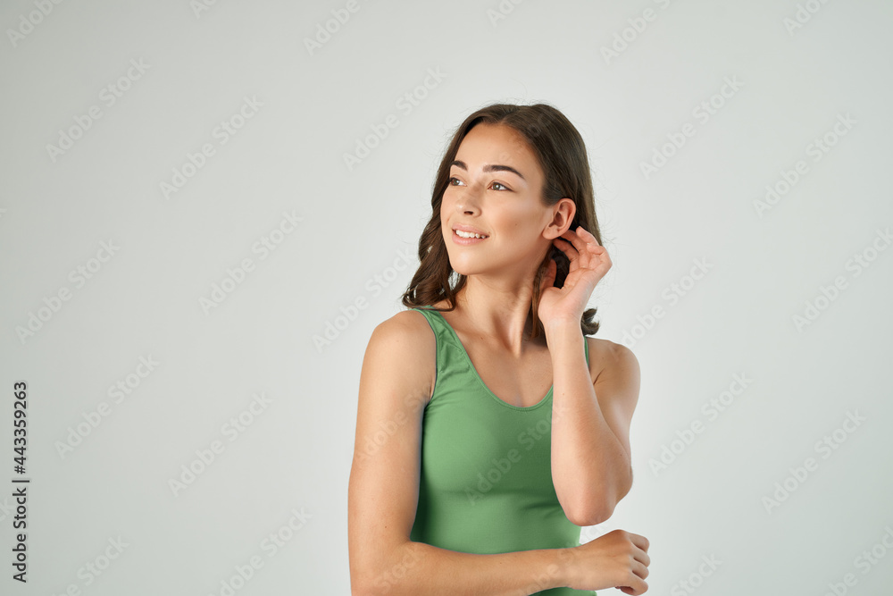 pretty brunette holding hair fashion hairstyle posing light background pretty brunette holding hair fashion hairstyle posing light background