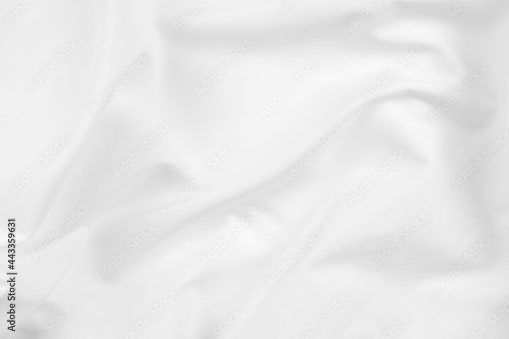 Abstract white fabric texture background. Cloth soft wave. Creases of satin, silk, and cotton.