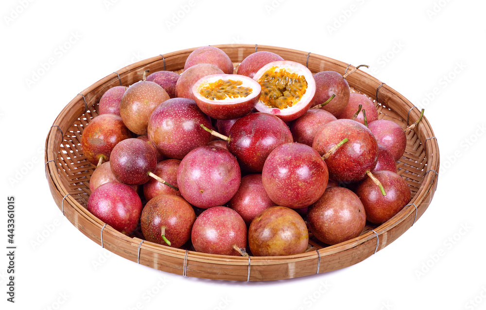 Passion fruit in wicker basket isolated on white Passion fruit in wicker basket isolated on white