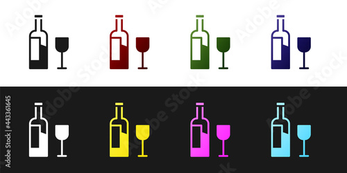 Set Wine bottle with glass icon isolated on black and white background. Vector