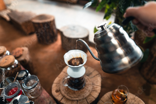 Pouring a hot water over a drip coffee