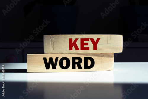 Wooden cubes with word KEYWORD on white table