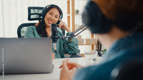 Canvas-taulu Asia girl radio host record podcast use microphone wear headphone interview celebrity guest content conversation talk and listen in her room