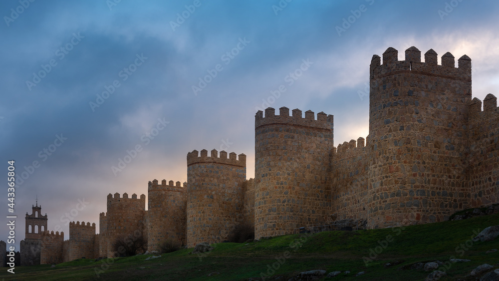 Medieval city wall built in the Romanesque style, Avila in Spain Medieval city wall built in the Romanesque style, Avila in Spain