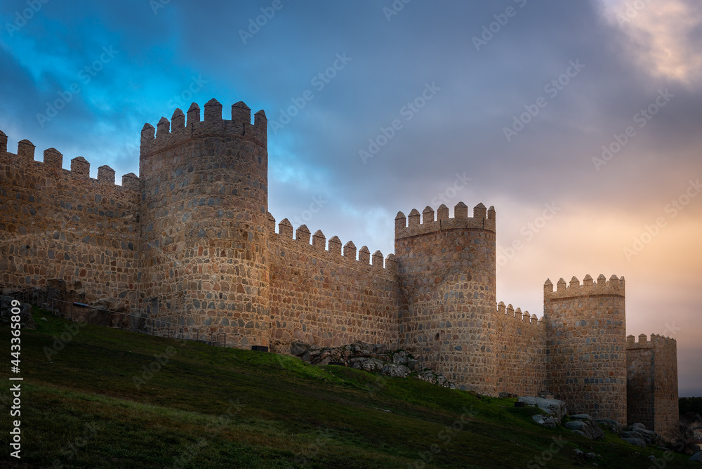 Medieval city wall built in the Romanesque style, Avila in Spain
