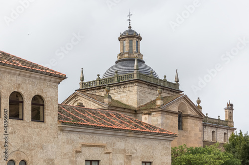 Back view at the dome copula tower at the iconic spanish Romanesque and Renaissance architecture building at the Iglesia de Cerralbo, downtown city photo