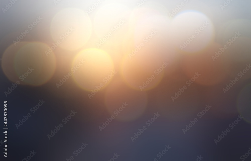 Big bokeh dawn sky golden glow on brown background. Blur illustration. Big bokeh dawn sky golden glow on brown background. Blur illustration.